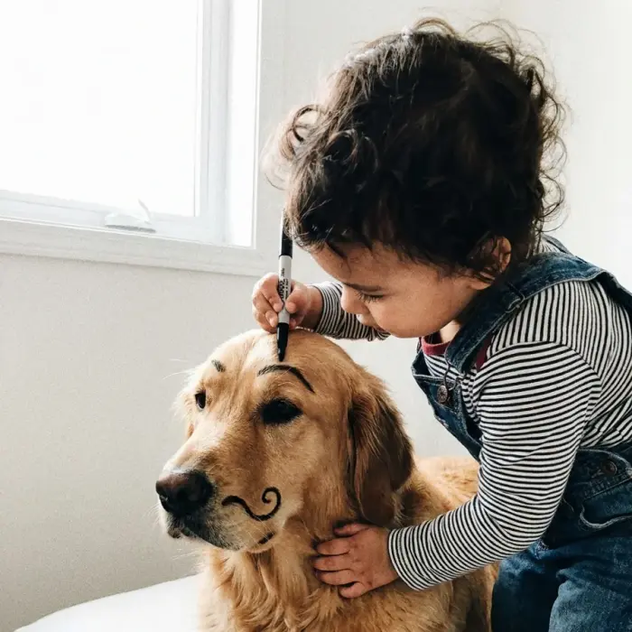 A photo of a child and the family dog, the kind you send us to work from