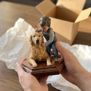 The piece held out in two hands, being given as a gift